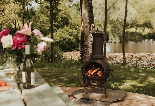 As dusk falls, light the chiminea and stay cosy. 