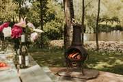 As dusk falls, light the chiminea and stay cosy.