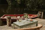 Take to the water on the quaint rowing boat, or enjoy a spot of yoga on the decking. 