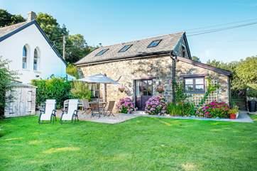 Al fresco dining is a must.
The garden is fenced off with 4ft stock fencing all the way around from the parking area. The fencing to the right of the picture now sits in the middle of the hedge that has grown up creating a lovely back drop to the garden.