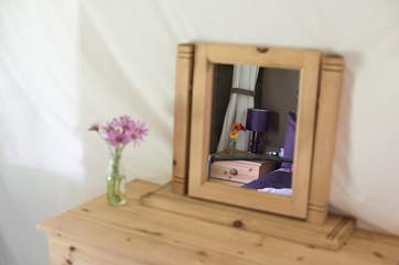 Foxglove's double bedroom has a pine chest of drawers for clothes storage.