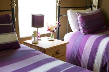 A bedside light is provided in the twin bedroom, perfect for night time reading.
