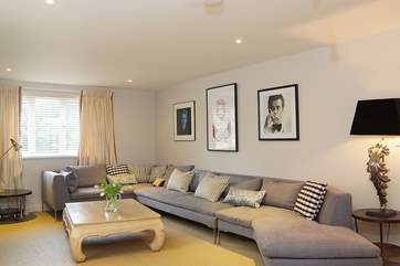 The huge corner sofa has room for all if you want to snuggle up and enjoy a family film night.