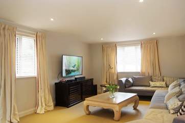 The big wall-mounted TV offers plenty of channels, or bring your favourite DVDs to watch at leisure.