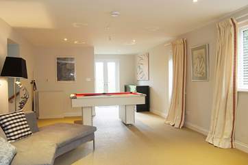 Doors from the family/games-room lead out to the garden and four acres of meadow and orchard.