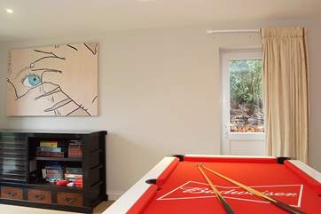 There is a cupboard full of games and puzzles providing entertainment for all ages.