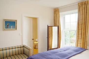 Bedroom 1 looks out over the garden and meadow to the rear.