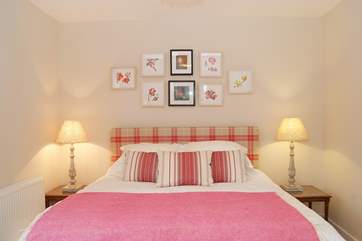 There are beautifully themed pictures, cushions and throws in each bedroom.