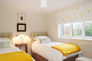 Bedroom 6 is at the front of the house and has twin beds.