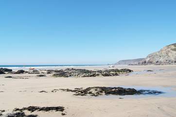 Porthtowan beach at low tide, perfect for surfing and buckets and spades (patrolled by RNLI Lifeguards throughout the season).