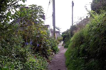Follow the path from the cottage down to the cove to visit the pub or take the next right back up to the car park which is shared with Coth Lytherva.