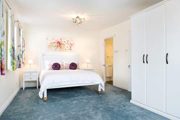 Bedroom One is very spacious and has a super comfy king-size bed