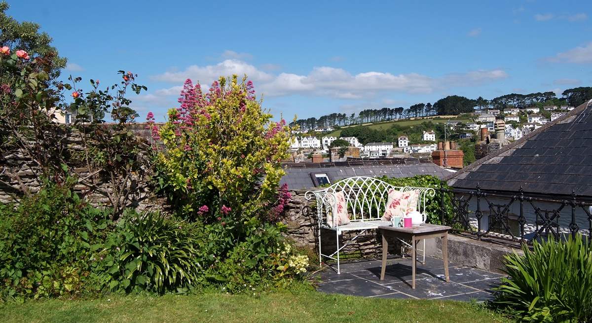 As well as the full patio-table and chair set, there is a pretty little place to catch the morning sun with a coffee.