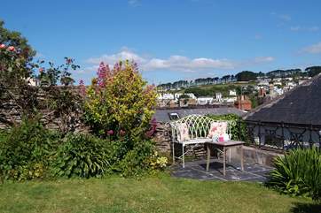 As well as the full patio-table and chair set, there is a pretty little place to catch the morning sun with a coffee.