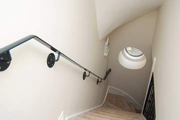 The stairs up from the ground floor to the open plan living-room and bedroom 1.