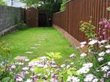 Steps lead up from the courtyard to this lovely fully enclosed garden.