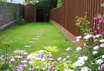 Steps lead up from the courtyard to this lovely fully enclosed garden.