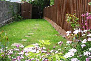 Steps lead up from the courtyard to this lovely fully enclosed garden.