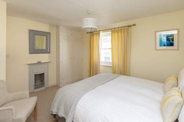 The bedroom has its original Victorian cast iron fireplace as a pretty feature.