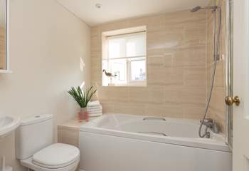 This is the family bathroom on the first floor, offering a bath as well as the fitted shower.