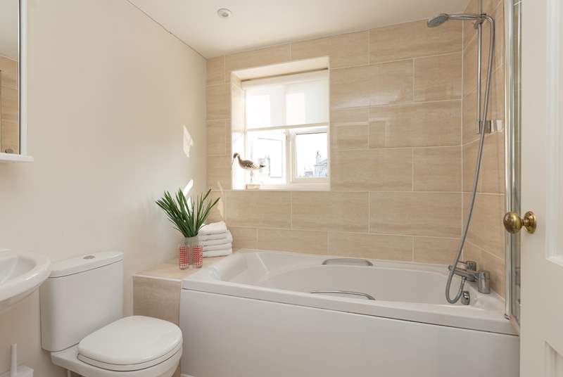 This is the family bathroom on the first floor, offering a bath as well as the fitted shower.