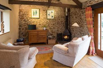 Cosy living-room with wood-burner.