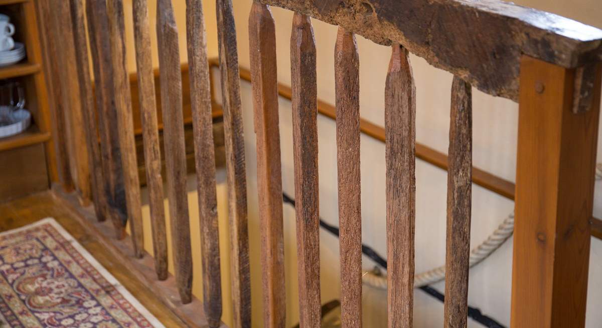 The wooden staircase up to the top floor.