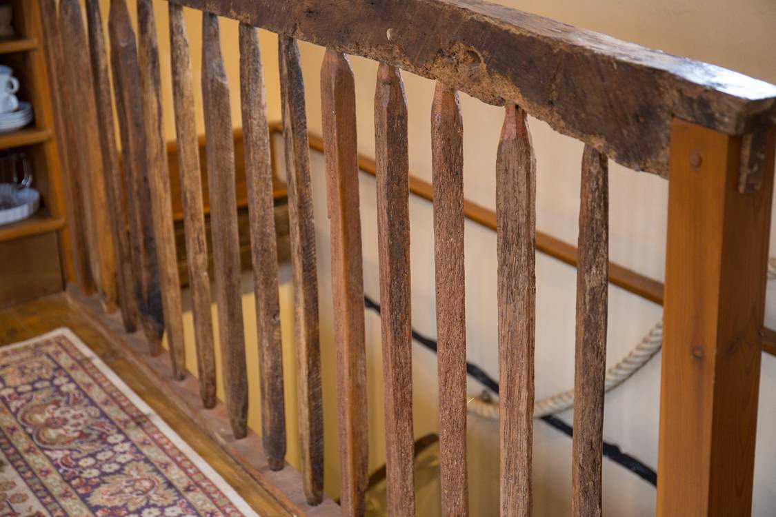 The wooden staircase up to the top floor.