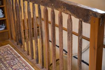 The wooden staircase up to the top floor.