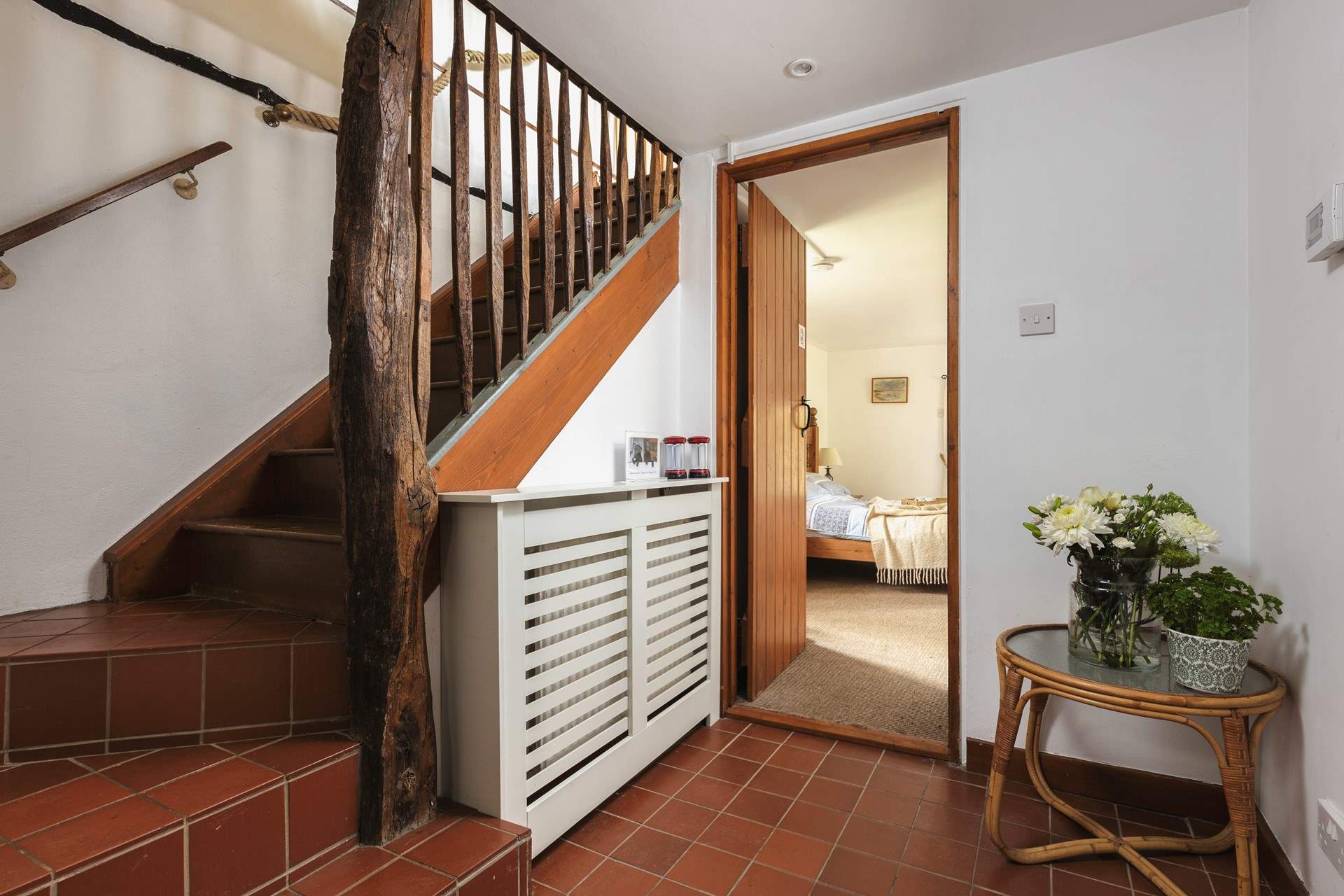 The bedroom is just off the entrance hall.