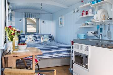 The hut is surprisingly spacious inside, with all you could need for a comfortable glamping break.