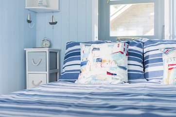 The king-size bed is positioned to look out the stable-door to the sea in the distance - a cuppa in bed in the mornings is a must!
