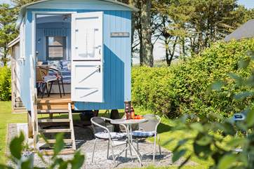 There is room to the front of the hut to dine al fresco (please note, the barbecue and chiminea have been replaced with a fire-pit barbecue).