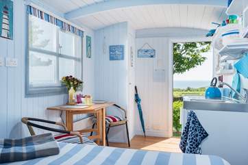 The comfy bed is positioned to look straight out the stable door to the sea in the distance - perfect for enjoying a morning cuppa in bed whilst taking in the stunning view.