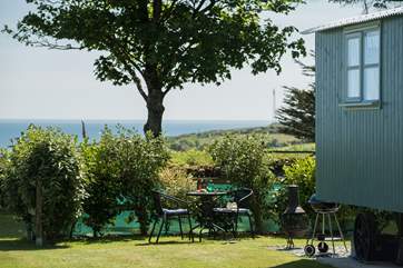 Mr Blue Sky sits in his spacious plot looking straight out to sea with his sister Forget Me Not next door (there is a hedge between them to ensure privacy). Please note, the barbecue and chiminea have been replaced with a fire-pit barbecue.
