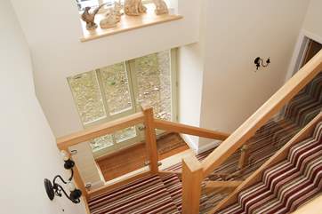Looking down into the entrance hall from the spacious landing-area above.