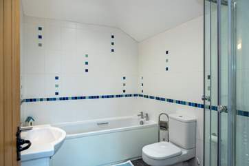 The family bathroom has a bath and separate shower.