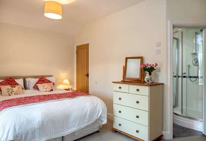 The master bedroom is spacious and has an en suite shower-room. 