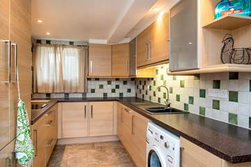 There is a separate utility-room off the kitchen with a second electric hob, washing machine and dishwasher.
