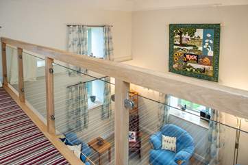 There is a balcony on the first floor overlooking the sitting-room.