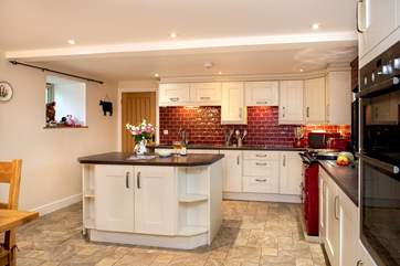There is a large island in the kitchen, perfect for prepping food or wine and nibbles.
