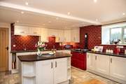 A fabulous large farmhouse kitchen, complete with an Aga. 