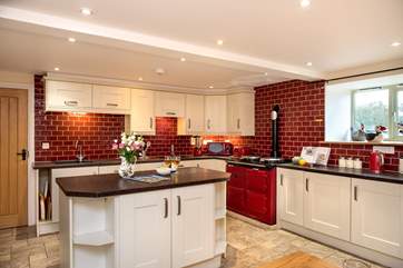 A fabulous large farmhouse kitchen, complete with an Aga.