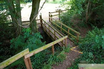 These wooden steps lead from the glamping site down to the lower meadow which has an enclosed play area, lake and network of footpaths beyond.