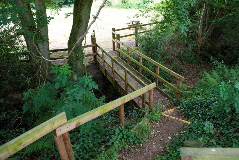 These wooden steps lead from the glamping site down to the lower meadow which has an enclosed play area, lake and network of footpaths beyond.