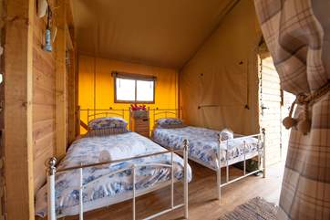 The second bedroom has cosy twin beds.