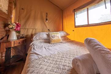 The pretty bedrooms are located at the back of the tent.