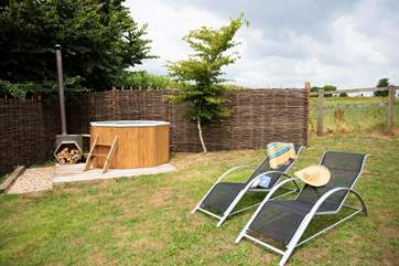 Enjoy lighting the stove and heating the water for an open-air hot tub experience. A large basket of logs can be purchased from the owner for £5.