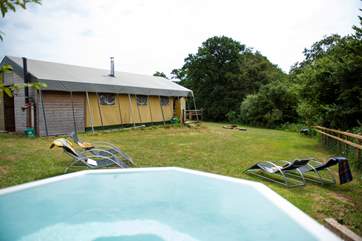 Beaver's Lodge and its wood-fired hot tub sit at the top of a gentle slope.