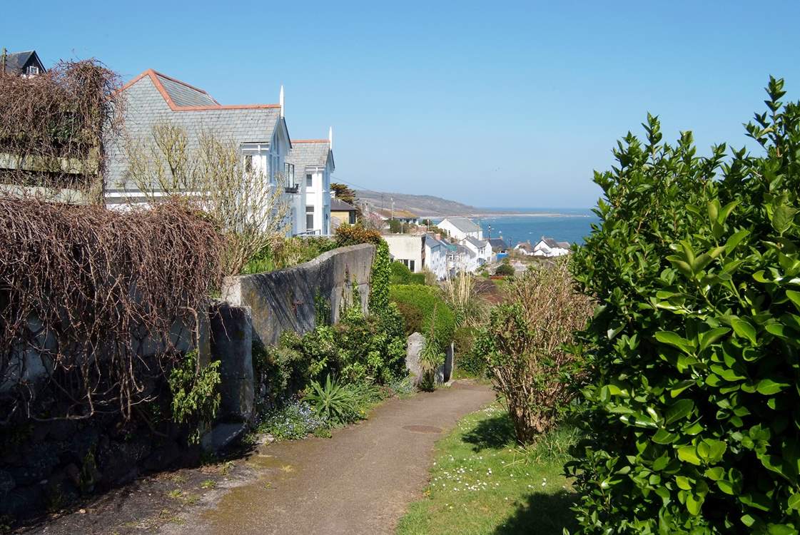 The downhill pathway to the pub and headland.